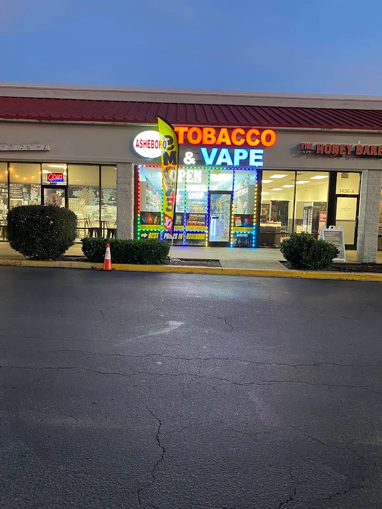Asheboro Tobacco & Vape storefront at dusk